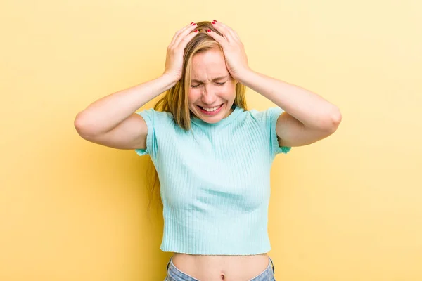 Young Adult Blonde Woman Feeling Stressed Frustrated Raising Hands Head — Stockfoto