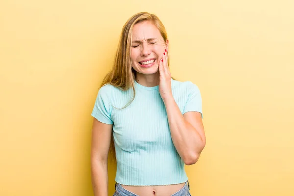 Young Adult Blonde Woman Holding Cheek Suffering Painful Toothache Feeling — Stockfoto