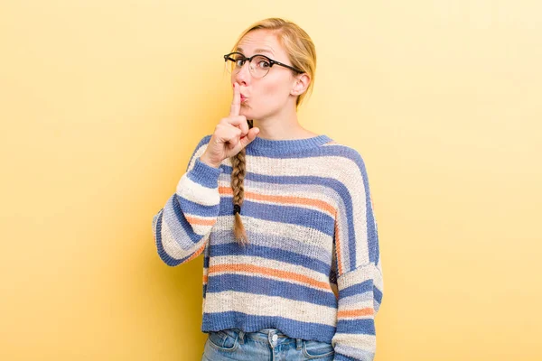 Young Adult Blonde Woman Asking Silence Quiet Gesturing Finger Front — Stockfoto