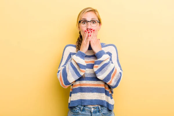 Young Adult Blonde Woman Happy Excited Surprised Amazed Covering Mouth — Zdjęcie stockowe