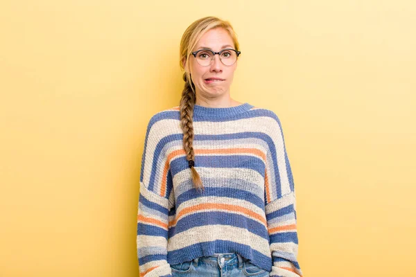 Young Adult Blonde Woman Looking Puzzled Confused Biting Lip Nervous — Stock Photo, Image
