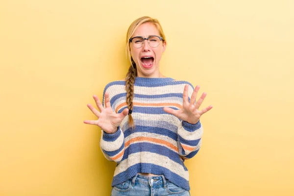 Young Adult Blonde Woman Feeling Stupefied Scared Fearing Something Frightening — Foto Stock