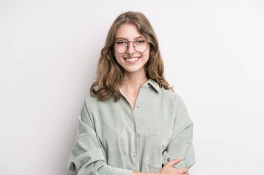 teenager young girl laughing shyly and cheerfully, with a friendly and positive but insecure attitude