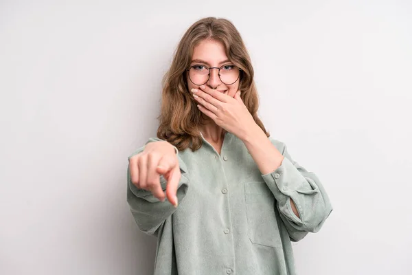 teenager young girl laughing at you, pointing to camera and making fun of or mocking you