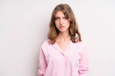 teenager young girl feeling sad, upset or angry and looking to the side with a negative attitude, frowning in disagreement