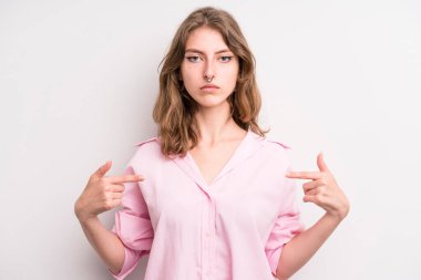 teenager young girl looking proud, positive and casual pointing to chest with both hands