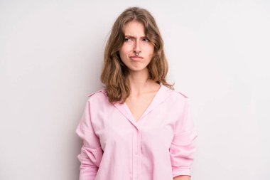 teenager young girl looking goofy and funny with a silly cross-eyed expression, joking and fooling around