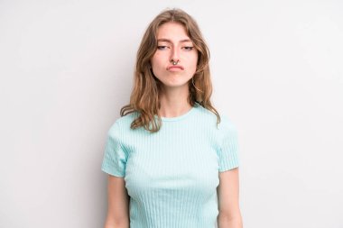 teenager young girl pressing lips together with a cute, fun, happy, lovely expression, sending a kiss