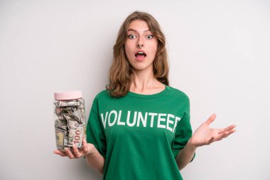 young girl with a donation banknotes bottle. volunteer concept