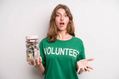 young girl with a donation banknotes bottle. volunteer concept