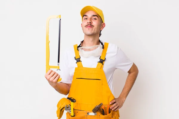 Young Adult Handsome Man Saw Handyman Concept — Zdjęcie stockowe