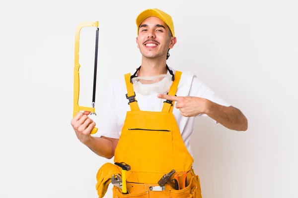 Young Adult Handsome Man Saw Handyman Concept — Stock fotografie