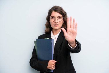 pretty young adult woman with notebooks. business concept