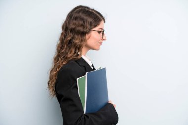 pretty young adult woman with notebooks. business concept