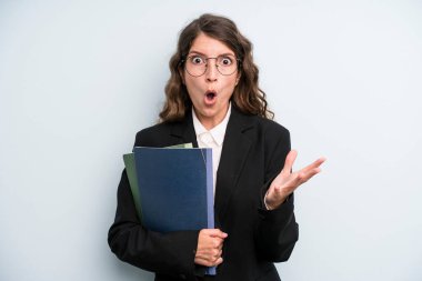 pretty young adult woman with notebooks. business concept