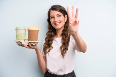 pretty young adult woman with take away coffee