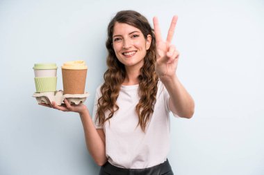 pretty young adult woman with take away coffee
