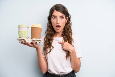 pretty young adult woman with take away coffee