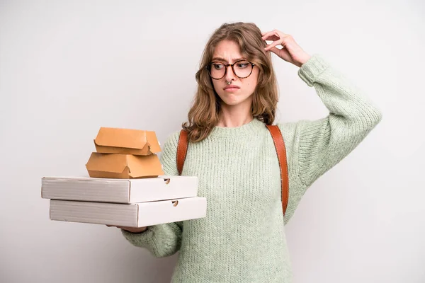 young girl with pizzas and burgers. take away fast food concept