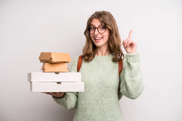 young girl with pizzas and burgers. take away fast food concept