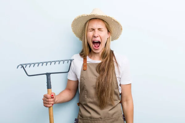 Young Blonde Woman Rake Farmer Concept — Stockfoto