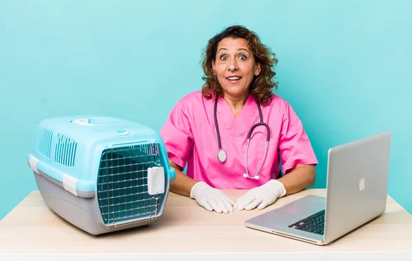 Middle Age Woman Looking Very Shocked Surprised Veterinarian Concept — Zdjęcie stockowe