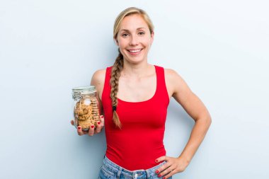young adult blonde woman. with home made cookies