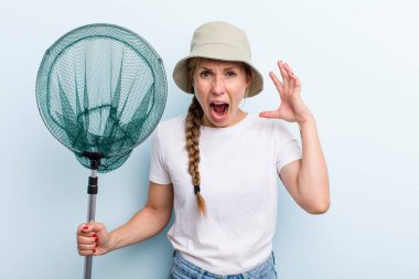 young adult blonde woman. fisher with a net and summer concept
