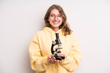 teenager girl. scientist student with a microscope