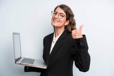 young adult pretty woman. holding a laptop