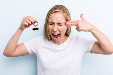 pretty blonde young adult woman with a car key