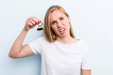pretty blonde young adult woman with a car key