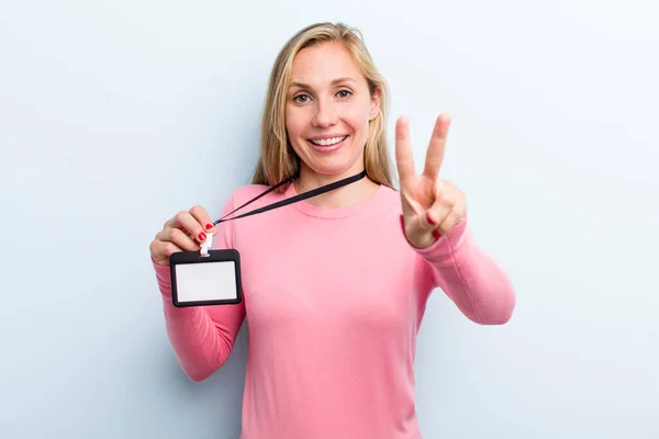 Pretty Blonde Young Adult Woman Showing Vip Pass — Stockfoto