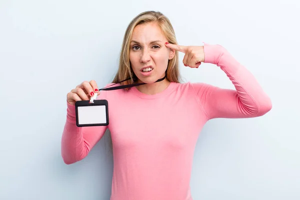 Pretty Blonde Young Adult Woman Showing Vip Pass — Zdjęcie stockowe