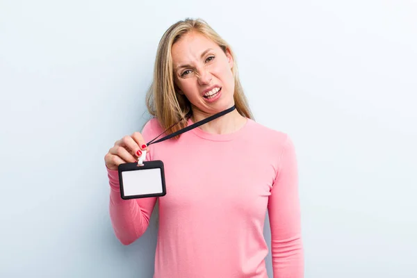 Pretty Blonde Young Adult Woman Showing Vip Pass — Stockfoto