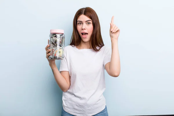 Young Adult Pretty Woman Holding Her Savings Bottle — Stockfoto