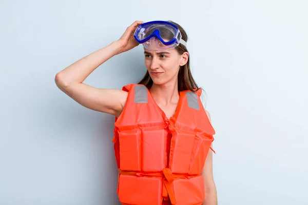 young adult pretty woman life jacket and summer concept