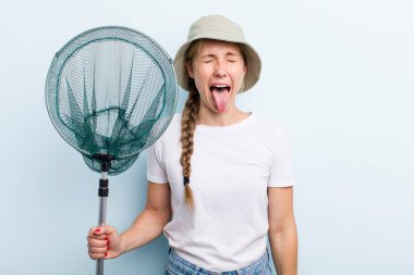 young adult blonde fisher woman with a net. holidays and hobbie concept