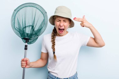 young adult blonde fisher woman with a net. holidays and hobbie concept