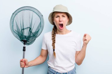 young adult blonde fisher woman with a net. holidays and hobbie concept