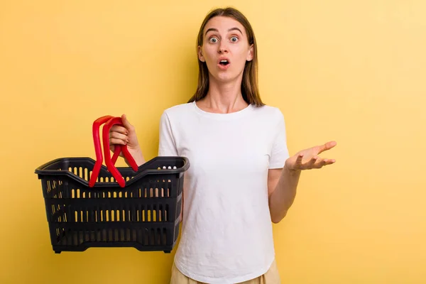 Young Adult Pretty Woman Holding Empty Shopping Basket — Stock Photo, Image
