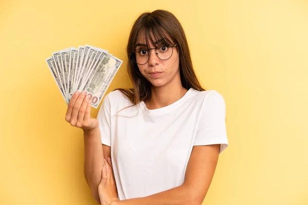 Hispanic Woman Shrugging Feeling Confused Uncertain Dollar Banknotes Concept — Foto Stock