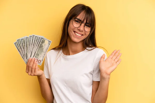 Hispanic Woman Smiling Happily Waving Hand Welcoming Greeting You Dollar — 스톡 사진