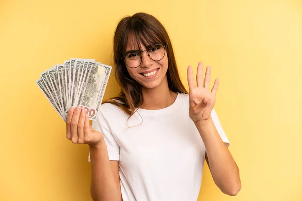 Hispanic Woman Smiling Looking Friendly Showing Number Four Dollar Banknotes — Foto Stock