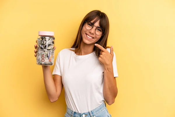 Hispanic Woman Smiling Confidently Pointing Own Broad Smile Savings Concept — Stockfoto