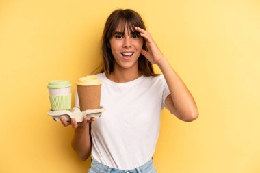 looking happy, astonished and surprised. take away coffees