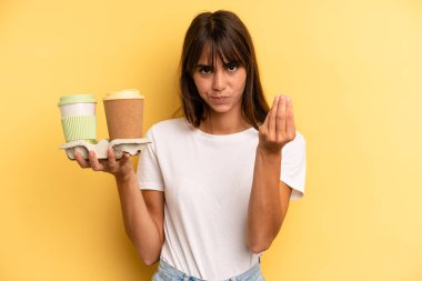 making capice or money gesture, telling you to pay. take away coffees