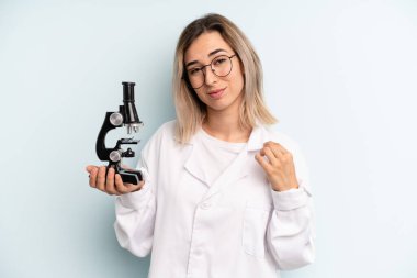 blonde woman looking arrogant, successful, positive and proud. scientist student concept