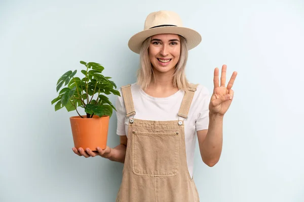 Blonde Woman Smiling Looking Friendly Showing Number Three Gardering Concept — Foto Stock