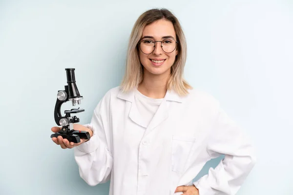 Blonde Woman Smiling Happily Hand Hip Confident Scientist Student Concept — Stockfoto